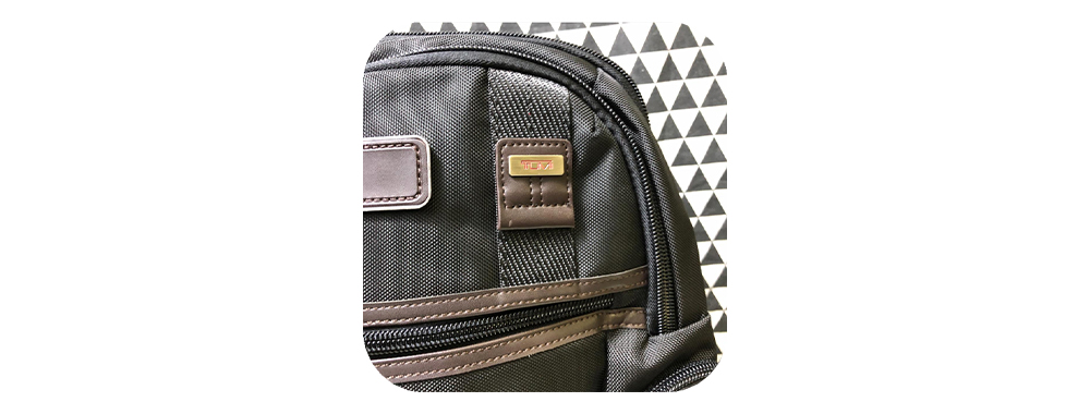 Tumi backpack nylon material and leather display
